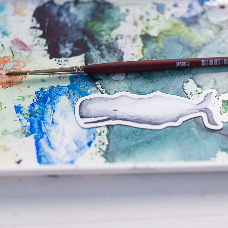 Whale watercolor sticker on watercolor palette