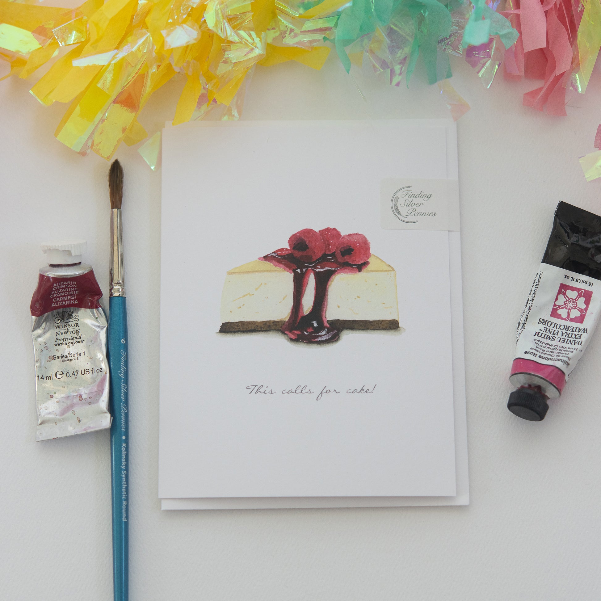 Cheesecake illustration on a card by Danielle Driscoll with paint and a paintbrush