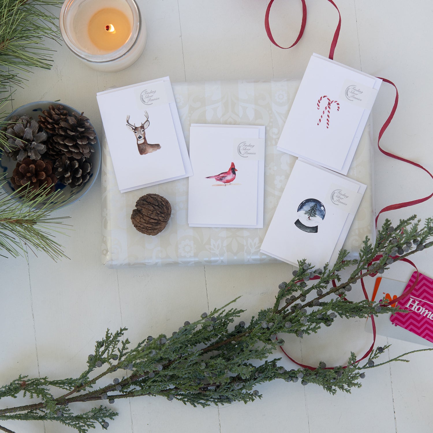 Set of Christmas-themed cards with decorative elements on a white surface