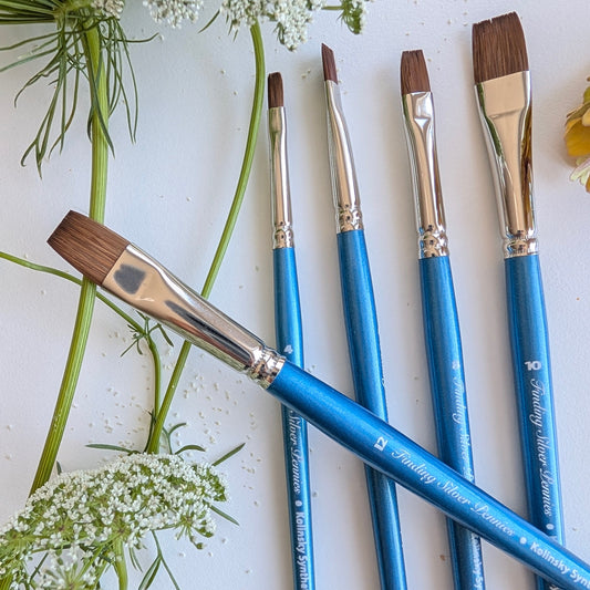 5 blue flat paintbrushes with flowers
