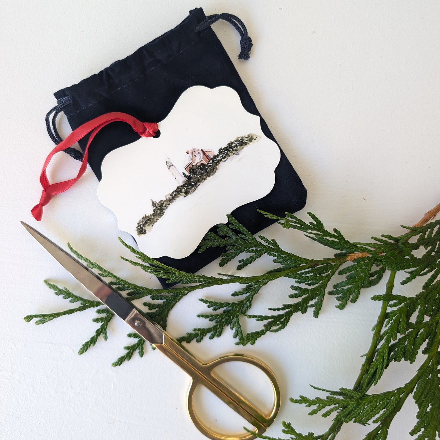 Scituate lighthouse ornament with navy blue bag