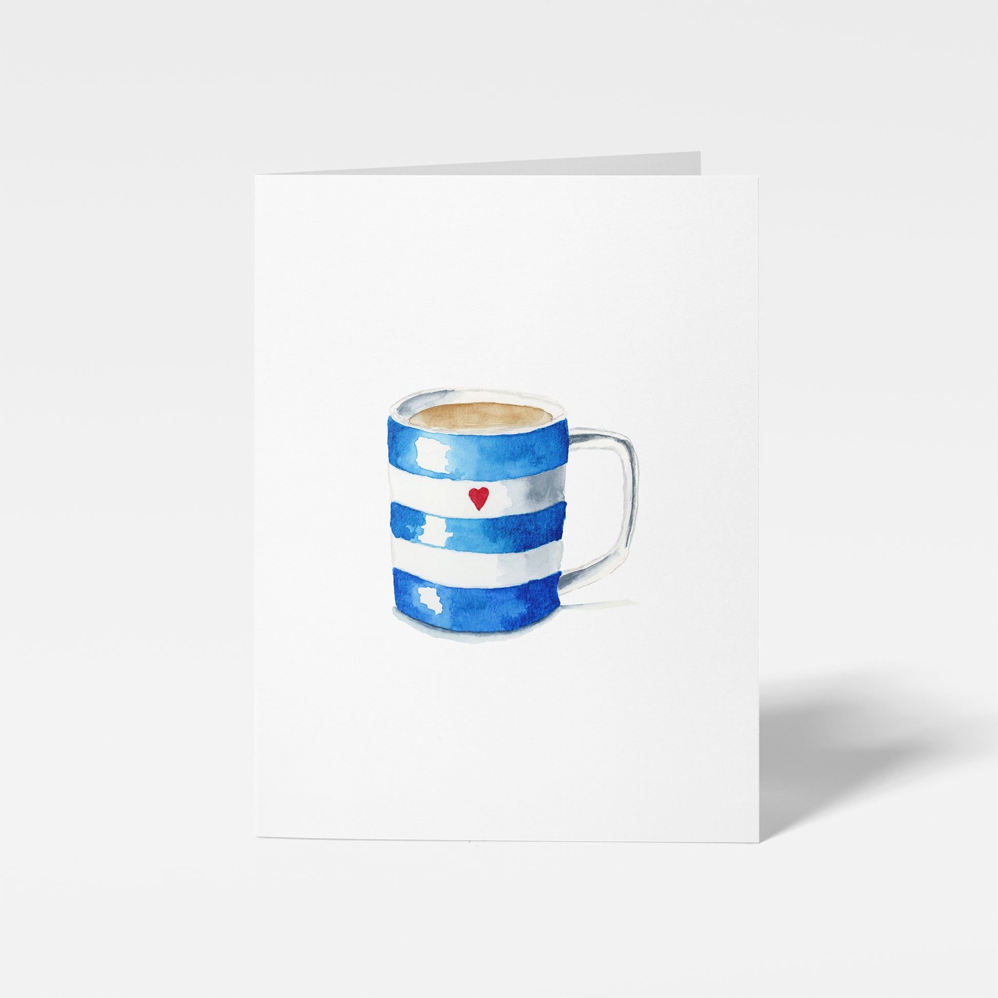 Blue and white striped mug with a red heart on a white background