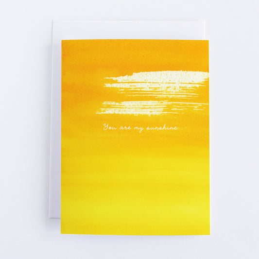 Yellow color wash card with white text 'You are my sunshine' on a white background
