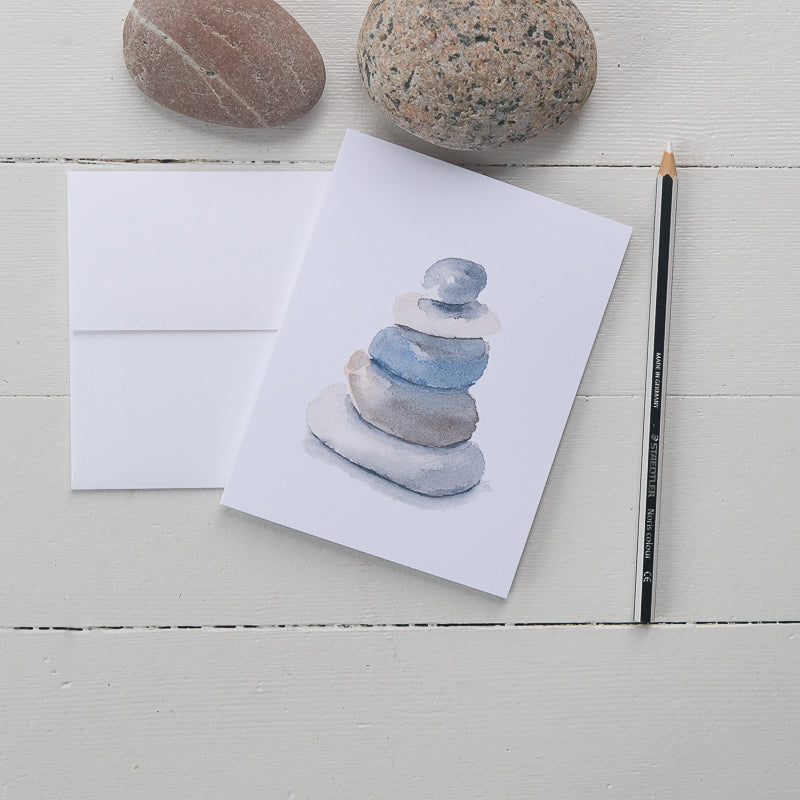Beach Rocks Watercolor Note Cards pictured with rocks and pencil