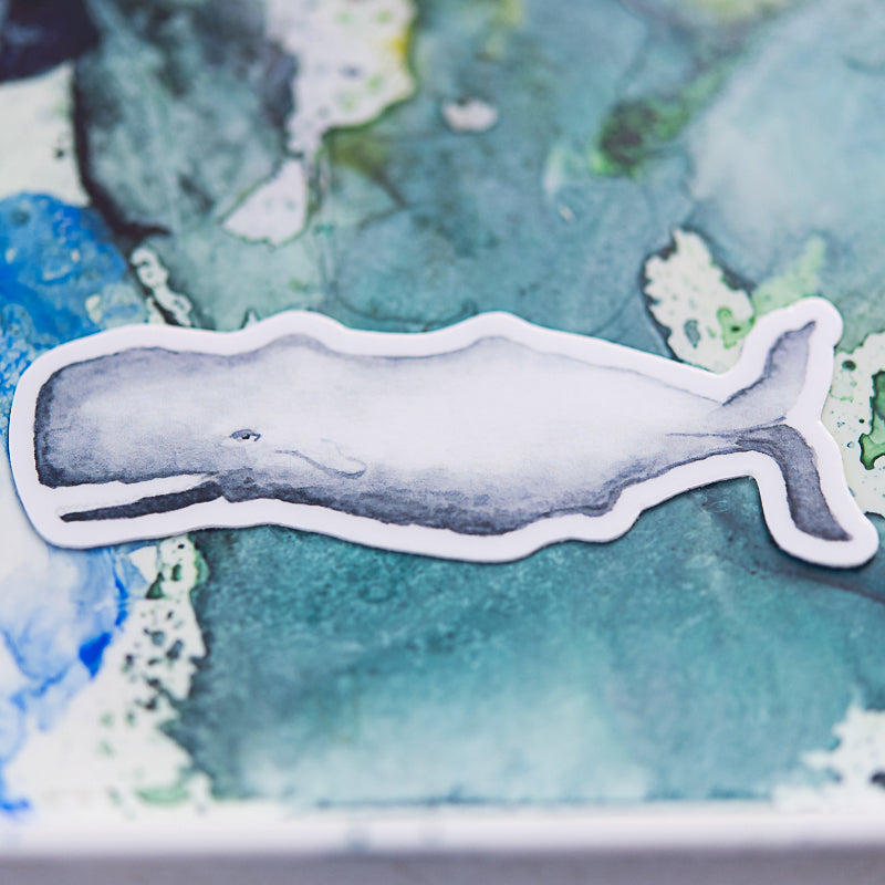 Whale watercolor sticker on watercolor palette