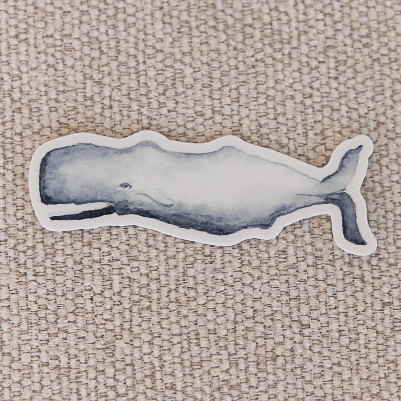 Watercolor Whale Sticker on tan background